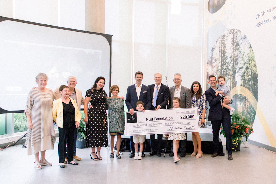 13 Harden Family members gathered to present the $220,000 cheque to the HGH Foundation