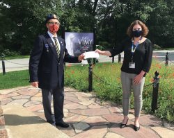 Cheque presentation at the Hudson Legion’s Place Vimy cenotaph by Poppy Fund Chairman, John Dalgarno, to HGH Foundation Executive Director, Erin Tabakman.