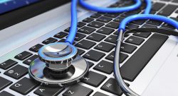 stethoscope on laptop keyboard