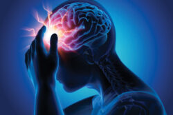 A person holding their head with their hand - showing a big headache.